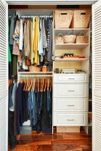 Clothes hung neatly in organized closet at home